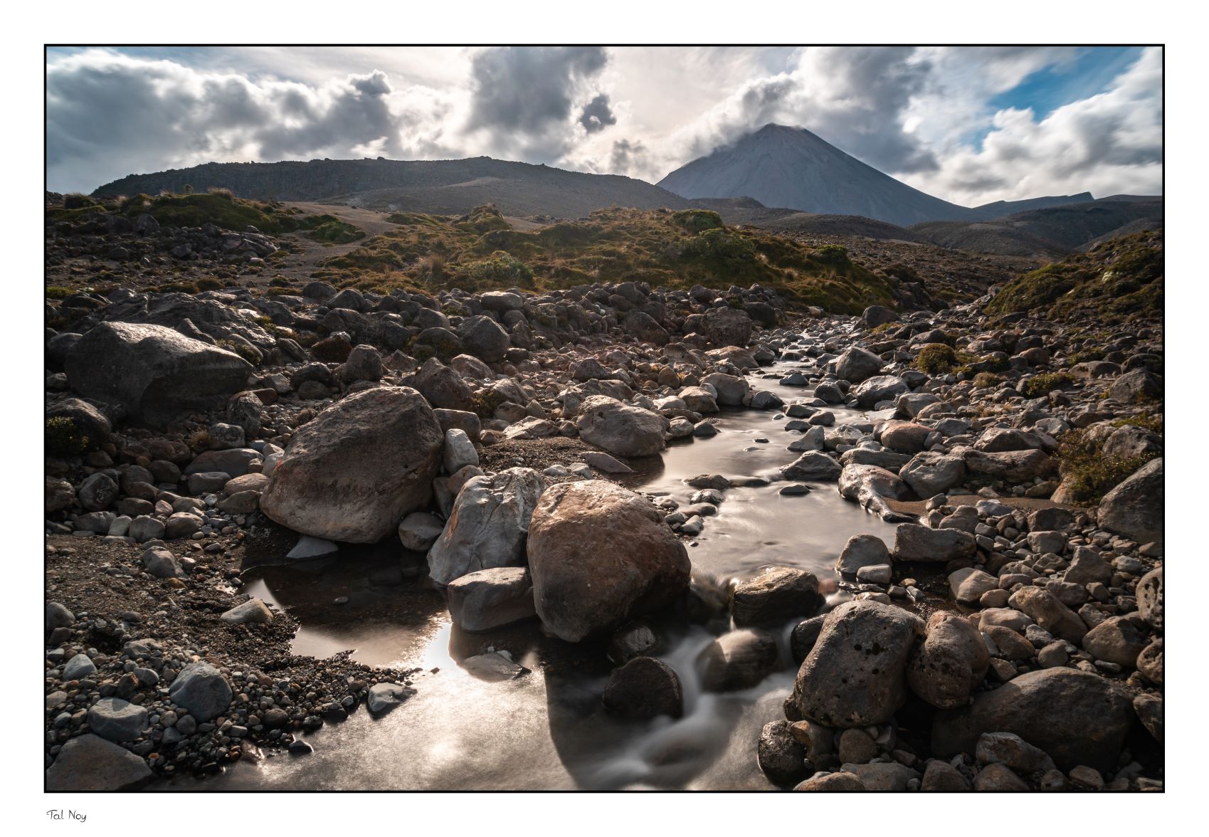 Mount Doom - dramatic volcanic peak rising through clouds